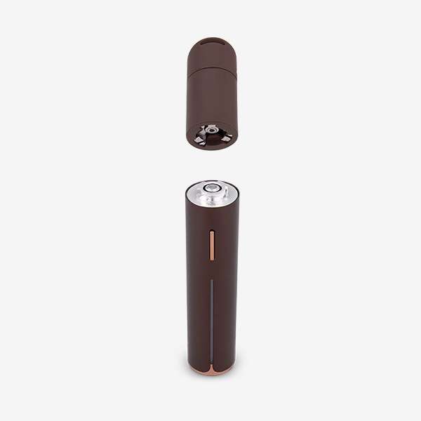 a brown cylindrical object with a lid open